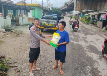 Polsek Natar Sigap Tangani Banjir di Tengah Pengamanan Nataru